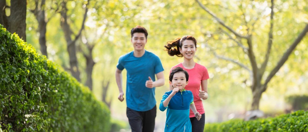 A family running together in a park