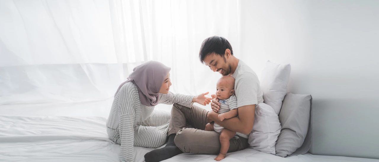 A mother caring for her baby at home